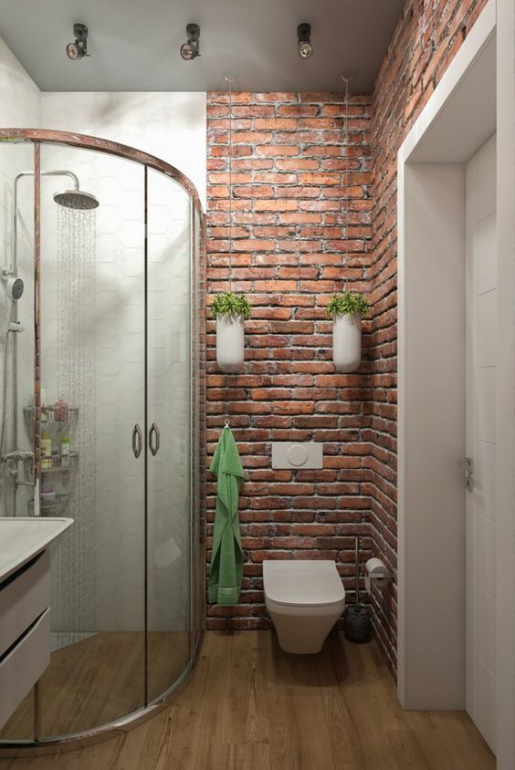 baños con pared ladrillo a la vista